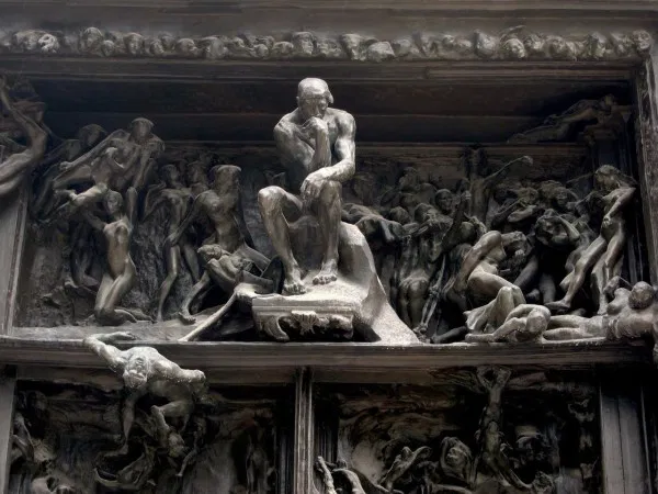 O Pensador (1904), de Auguste Rodin. A representação do esforço da razão. A filosofia como um trabalho ativo de forjar a clareza e construir a "Cidadela Interior" em meio ao ruído do mundo.